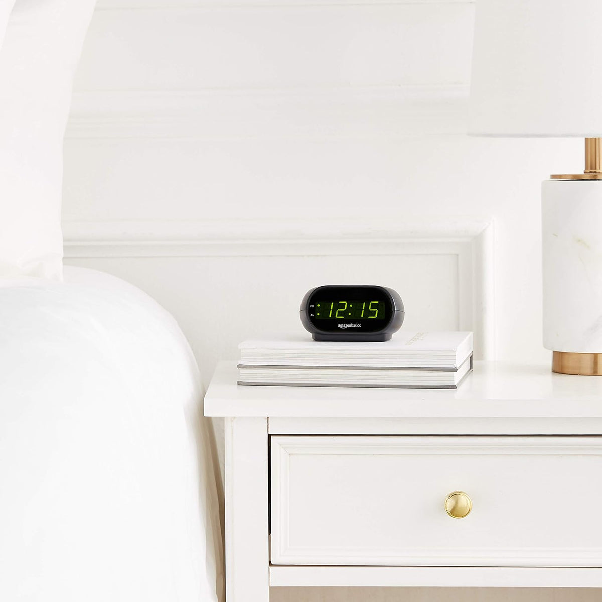 Amazon_Basics_Small_Digital_Oval_Alarm_Clock_with_LED_Display,_Nightlight,_Snooze_Function_&_Battery_Backup,_Black,_4.5_x_3.5_x_2.4_Inches