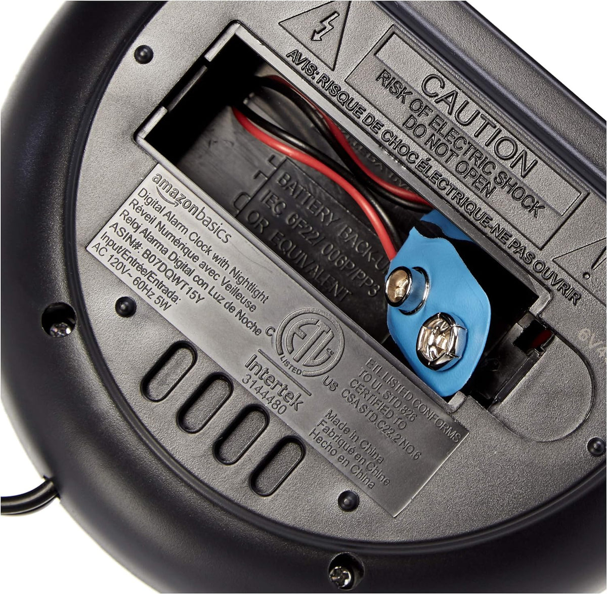 Amazon_Basics_Small_Digital_Oval_Alarm_Clock_with_LED_Display,_Nightlight,_Snooze_Function_&_Battery_Backup,_Black,_4.5_x_3.5_x_2.4_Inches