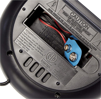 Amazon_Basics_Small_Digital_Oval_Alarm_Clock_with_LED_Display,_Nightlight,_Snooze_Function_&_Battery_Backup,_Black,_4.5_x_3.5_x_2.4_Inches
